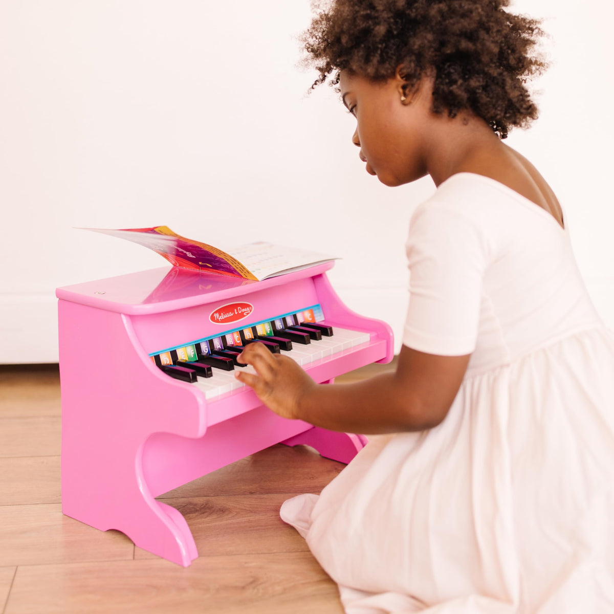 Melissa & Doug compact wooden piano fits small play areas.