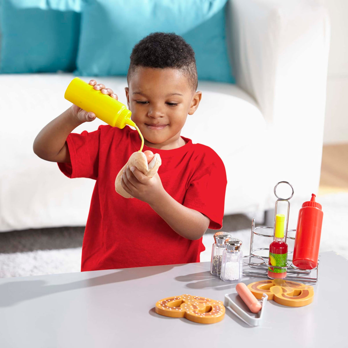 Melissa & Doug salt and pepper shakers in use, promoting fine motor play and counting
