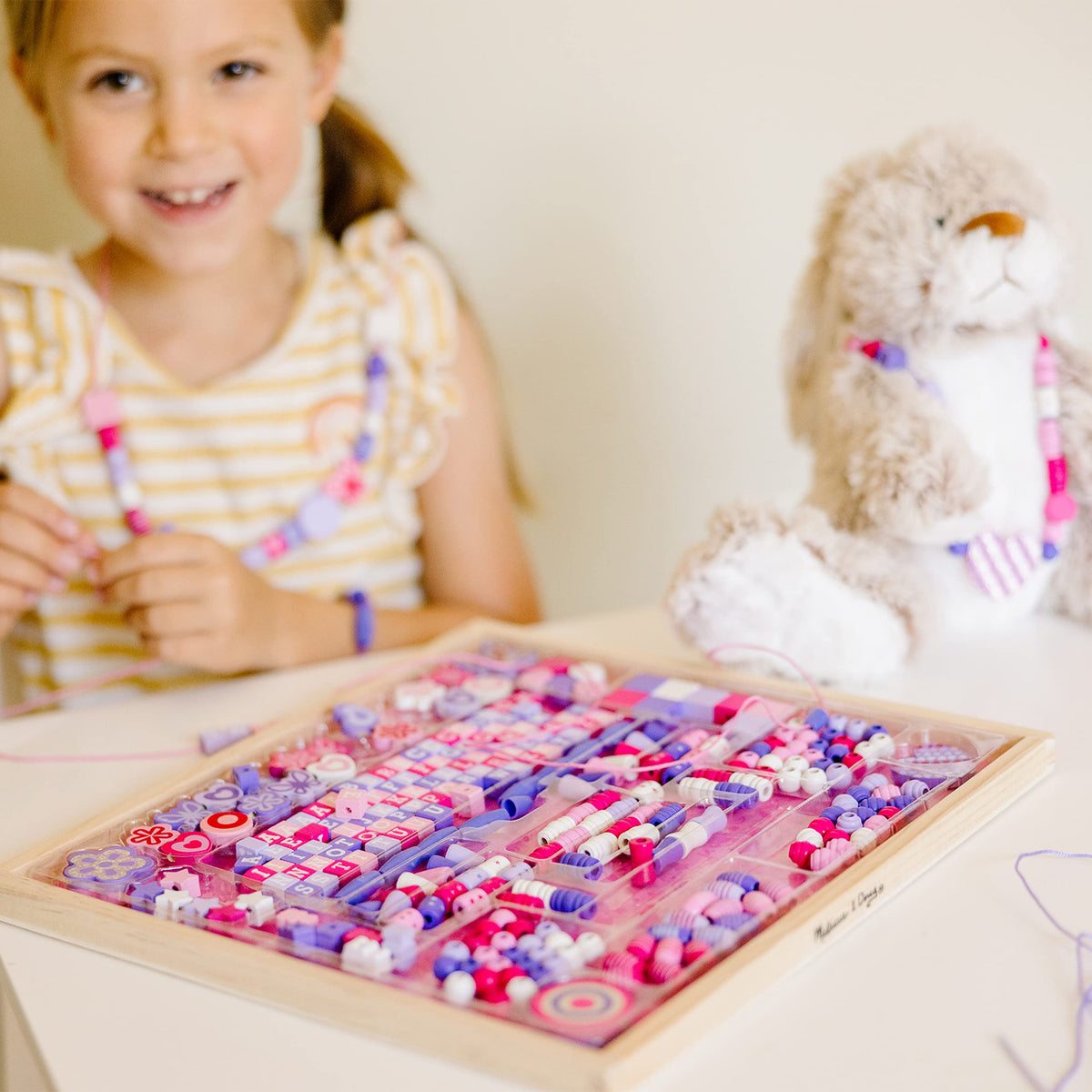 Melissa & Doug Created by Me Sparkle & Shimmer alphabet beads for personalized necklaces.