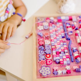 Melissa & Doug Created by Me Sparkle & Shimmer beads with laces and clasps for easy stringing.