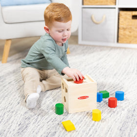 Melissa & Doug cube lid opening highlights the easy reset after shape sorting.