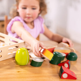 Melissa & Doug Cutting Food bright-cutting-board-knife setup encourages early math exploration.