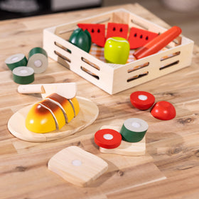 Melissa & Doug Cutting Food packaging-display showing organized play pieces.