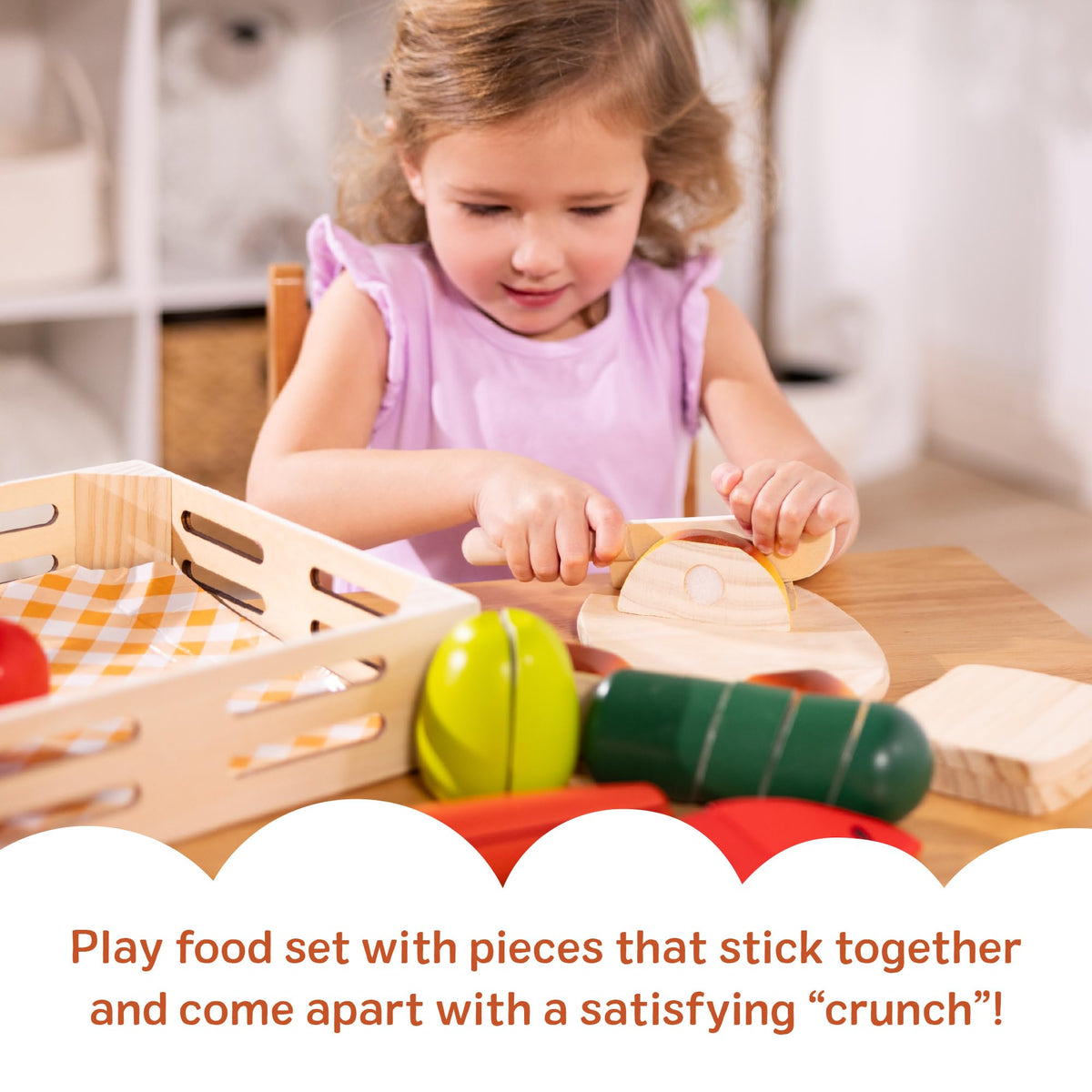Melissa & Doug Cutting Food self-stick-tabs-in-action aiding slicing and reassembly play.