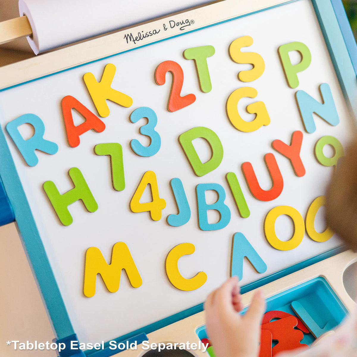 Melissa & Doug Deluxe Magnetic Letters and Numbers Set on fridge supports counting practice.