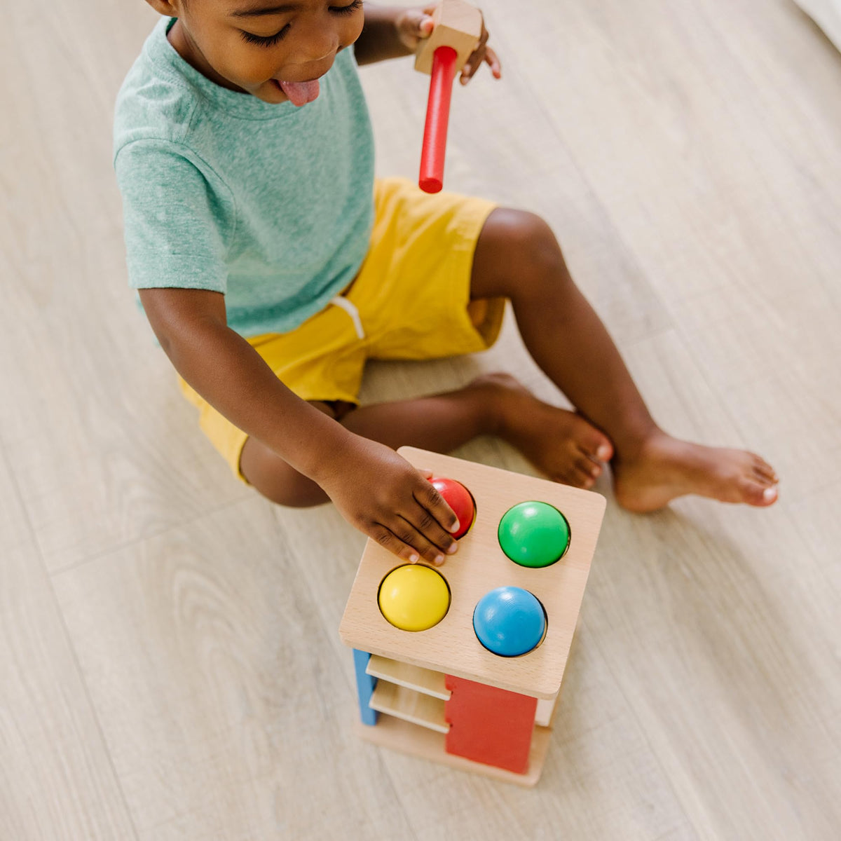 Melissa & Doug Pound & Roll Tower smoothed wood finish feels gentle to touch