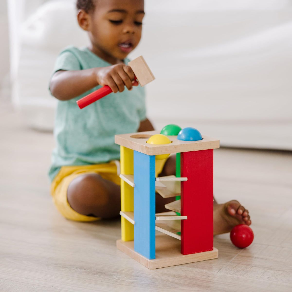 Melissa & Doug Deluxe Pound & Roll Tower toddlers' play promotes early counting and sequencing