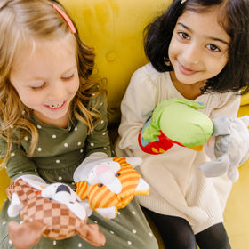Melissa & Doug Deluxe Puppet Theater complements the hand puppets for screen-free storytelling.