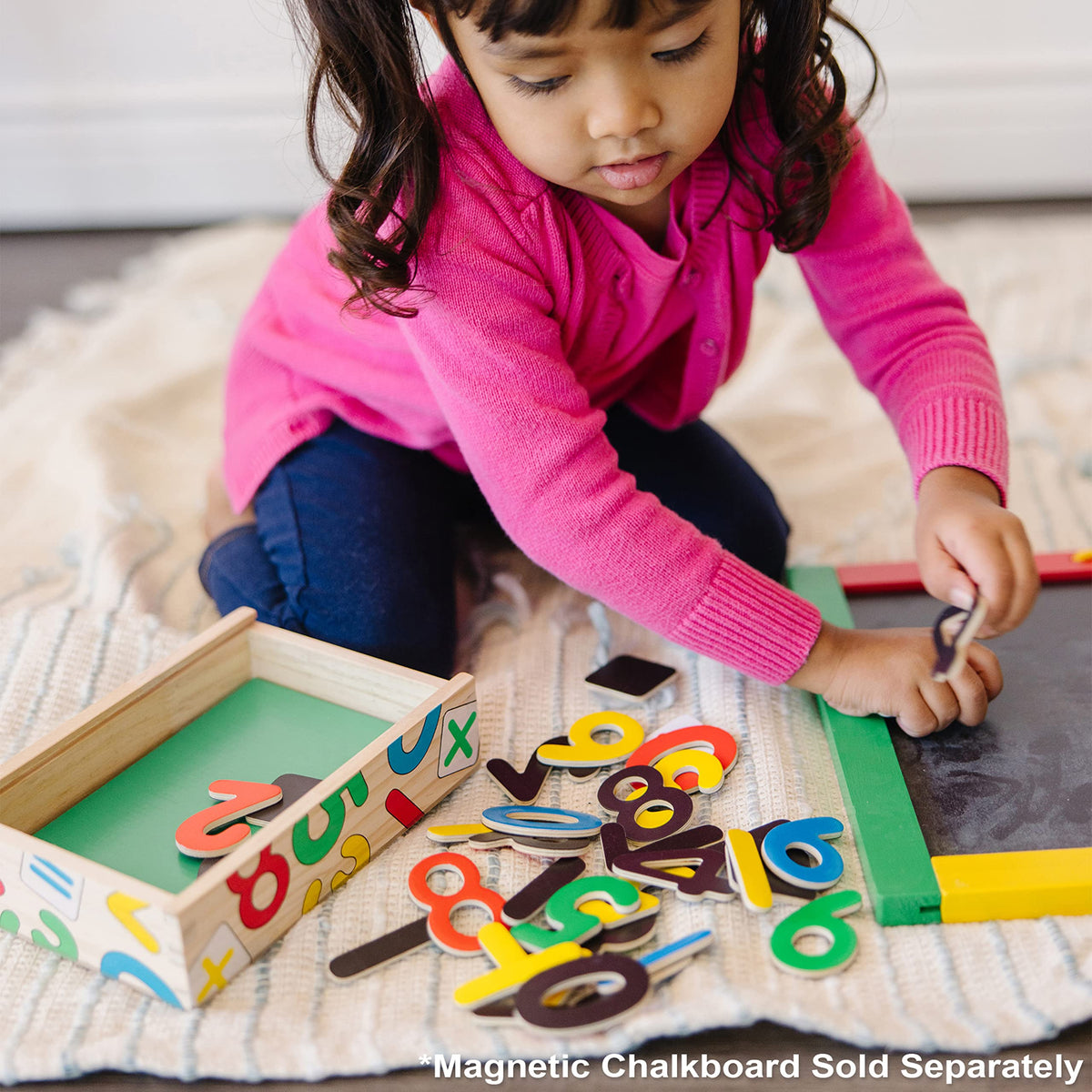 Melissa & Doug Deluxe Magnetic Letters and Numbers Set see-through lid aids quick cleanup.