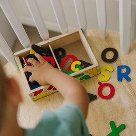 Melissa & Doug Deluxe Magnetic Letters and Numbers Set portable learning toy for travel.