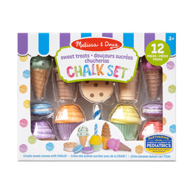 Melissa and Doug dessert chalk set on a sidewalk ready for play.