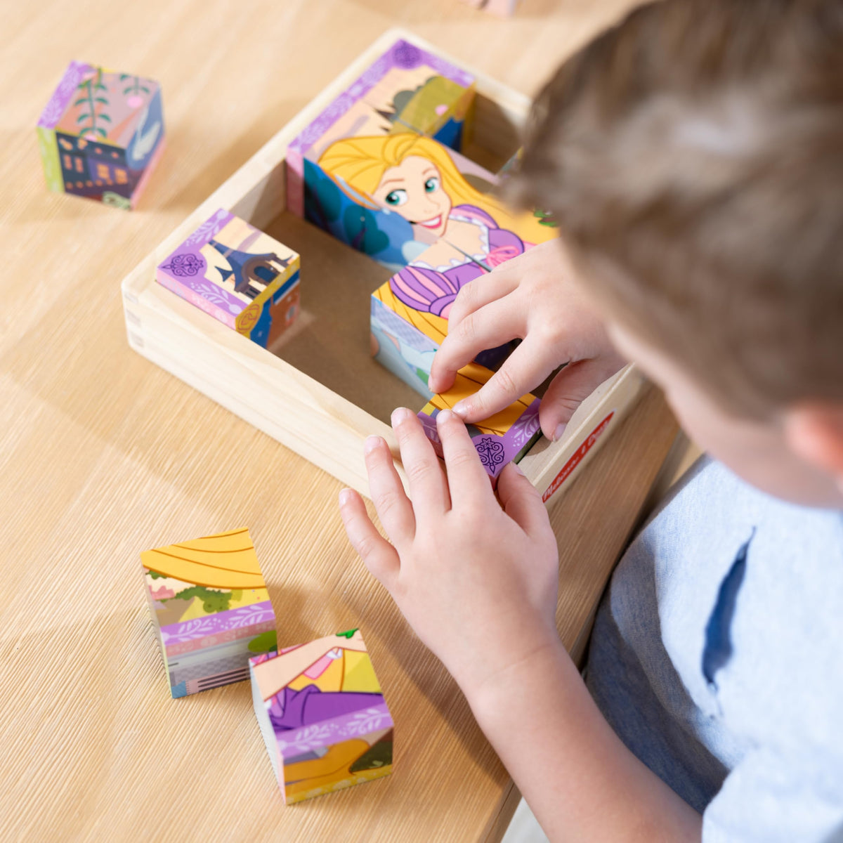 Melissa & Doug Disney Princess cube puzzle storage tray keeps blocks organized after play.