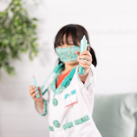 Melissa & Doug face mask adds authentic clinician detail.