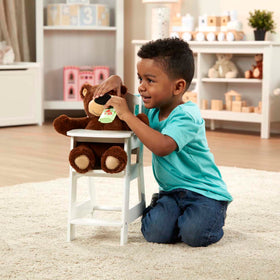 Melissa & Doug doll-care pretend play supports nurturing routines.