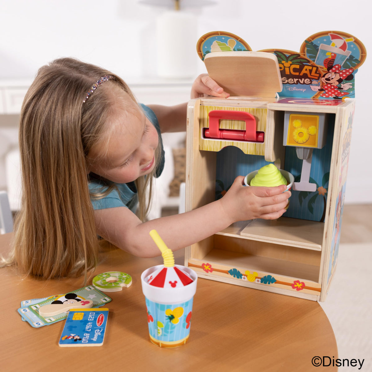 Wooden cup with umbrella straw enhances beachy pretend beverage play