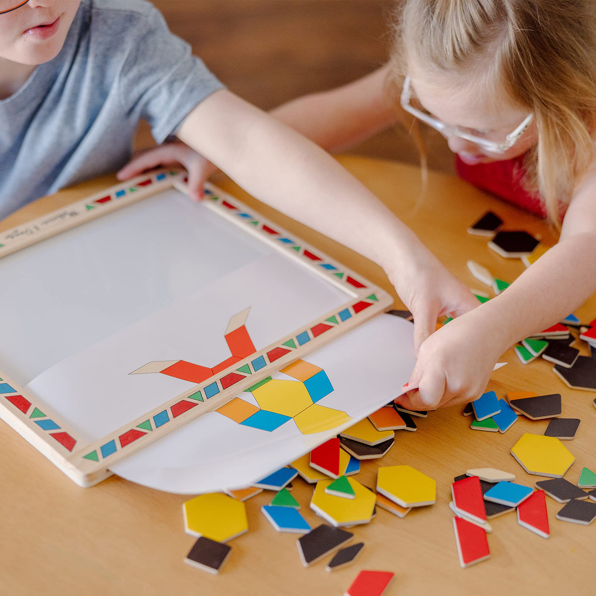 Melissa & Doug promotes fine motor skills through hands-on magnet activity.