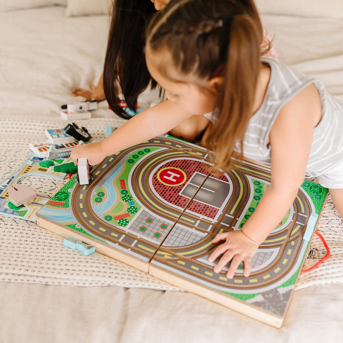 Melissa and Doug fire engine speeds along the town road system