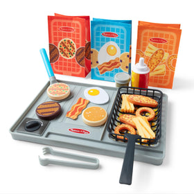 Melissa & Doug Flip & Fry Grill set on play surface for pretend grilling