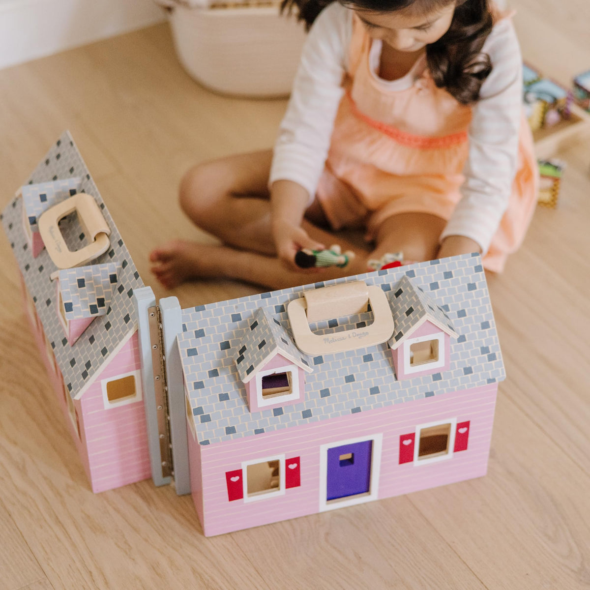 Durable wooden construction of the Fold & Go Dollhouse designed for kids.