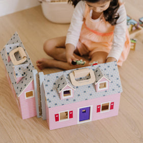 Durable wooden construction of the Fold & Go Dollhouse designed for kids.