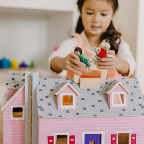 Fold & Go Dollhouse with four rooms and furniture ready for creative scenes.