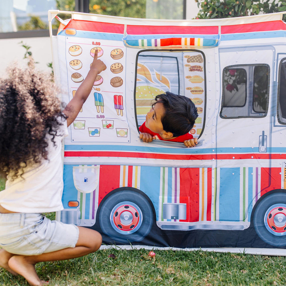 Melissa & Doug fabric food truck's sturdy floor and roll-up flaps withstand play