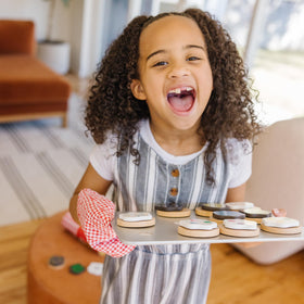 Melissa & Doug frosting toppings with self-stick tabs for easy decorating during pretend baking.