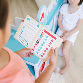 Melissa & Doug Get Well Doctor Center eye chart supports vision-testing play