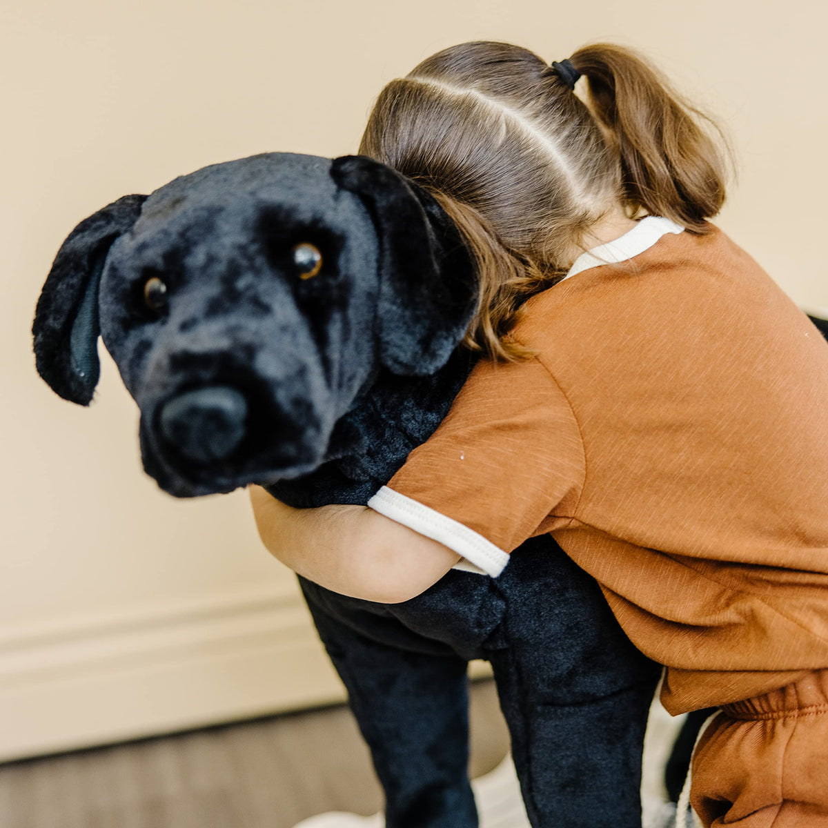 Melissa and Doug giant black lab plush in standing pose for upright display
