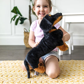 Melissa and Doug giant dachshund stuffed animal classic black and tan coloring.