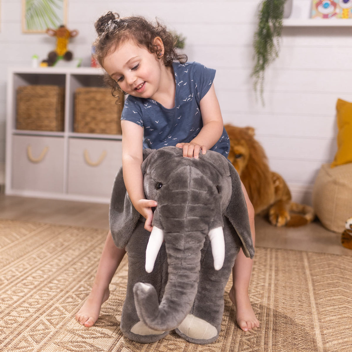 Melissa & Doug elephant spot clean with damp cloth for easy care.