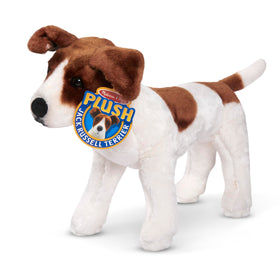 Melissa & Doug plush dog shown in a child’s embrace for comforting companionship