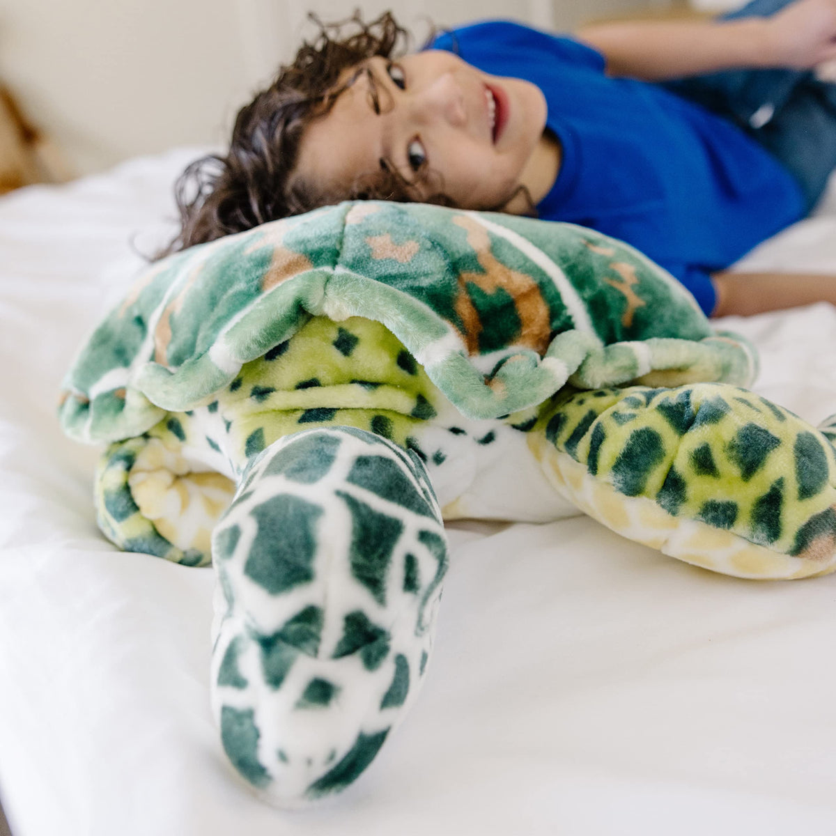 Age range 3 to 103 shown with Melissa & Doug Sea Turtle plush.