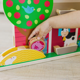 Melissa & Doug GO Tots carrying handle barn is portable for travel