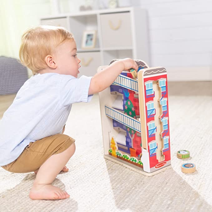 Melissa & Doug GO Tots town house fire escape image shows compact, mobile play with compatible sets