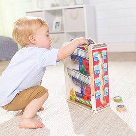 Melissa & Doug GO Tots town house fire escape image shows compact, mobile play with compatible sets