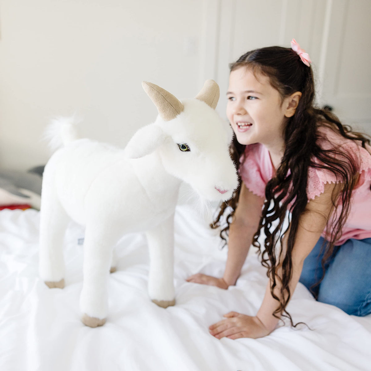 Goat plush features a soft beard for cozy pretend play by Melissa and Doug.