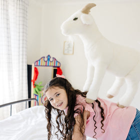 Goat plush with split hooves helps it stand upright.