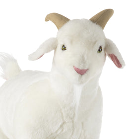Goat plush shows tufted tail for realistic detail.