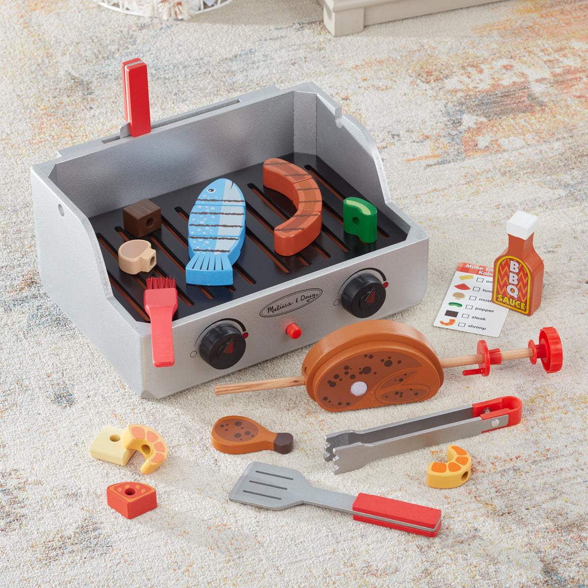 Melissa & Doug wooden knife enables safe cutting of food pieces.