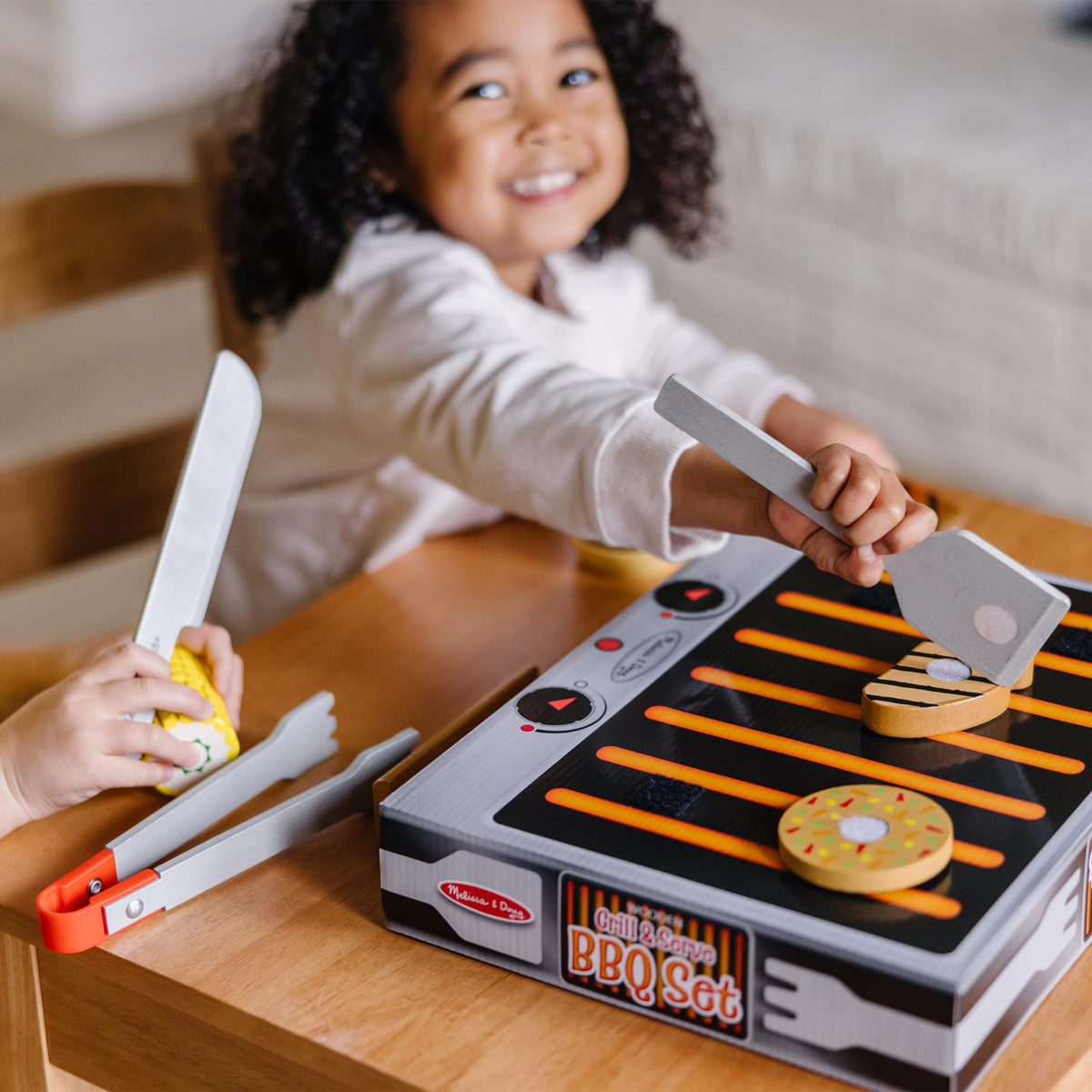 Melissa & Doug storage box that flips into a grill-inspired display.