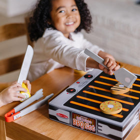 Melissa & Doug storage box that flips into a grill-inspired display.