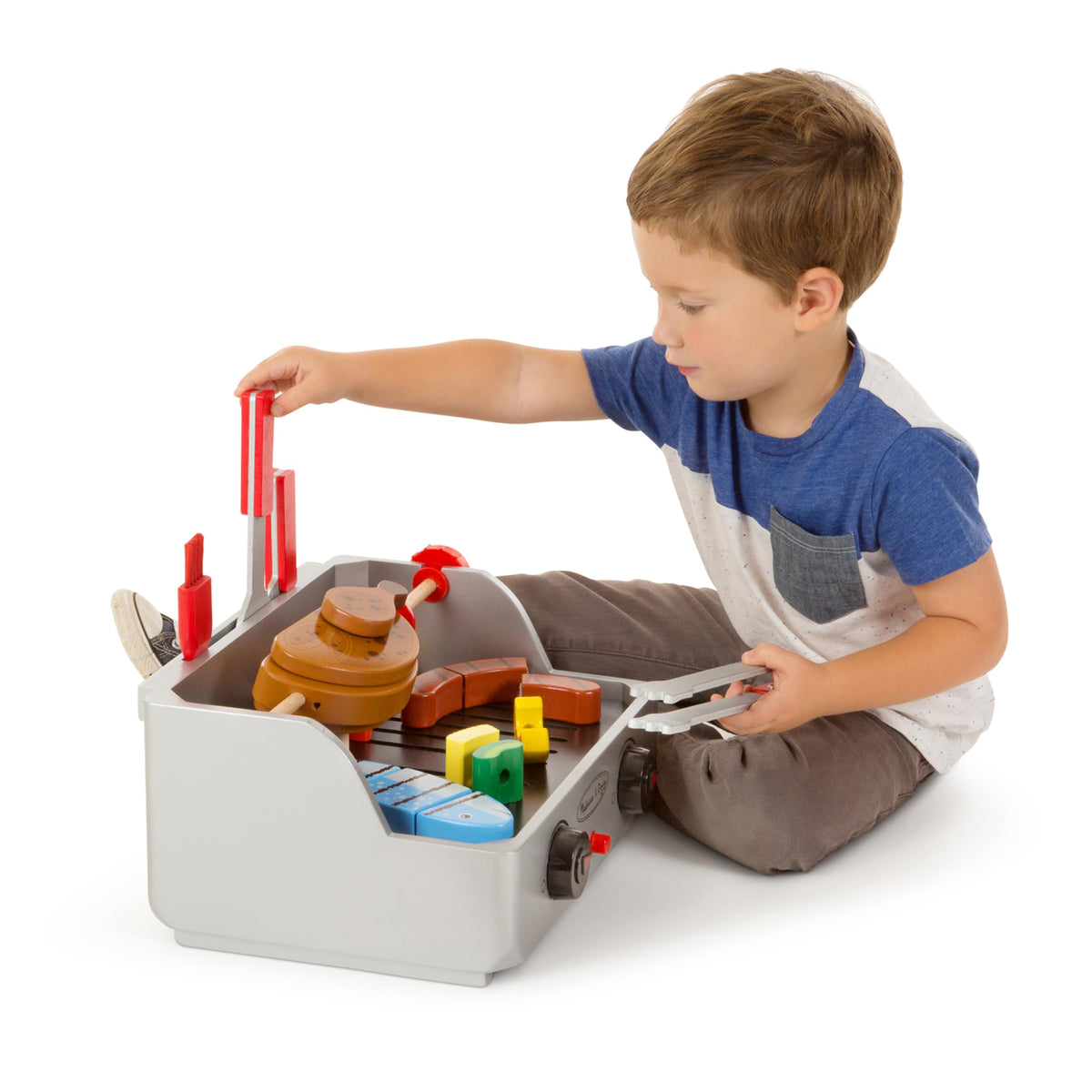 Melissa & Doug tongs help grab and serve toy meals.