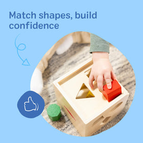 Matching holes on the Melissa & Doug cube support fine motor and problem-solving skills.