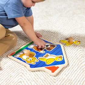 Melissa & Doug House Pets board close-up shows cozy house shape.