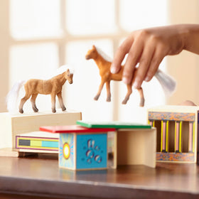 Melissa & Doug encourages fine motor skills and storytelling during playtime.