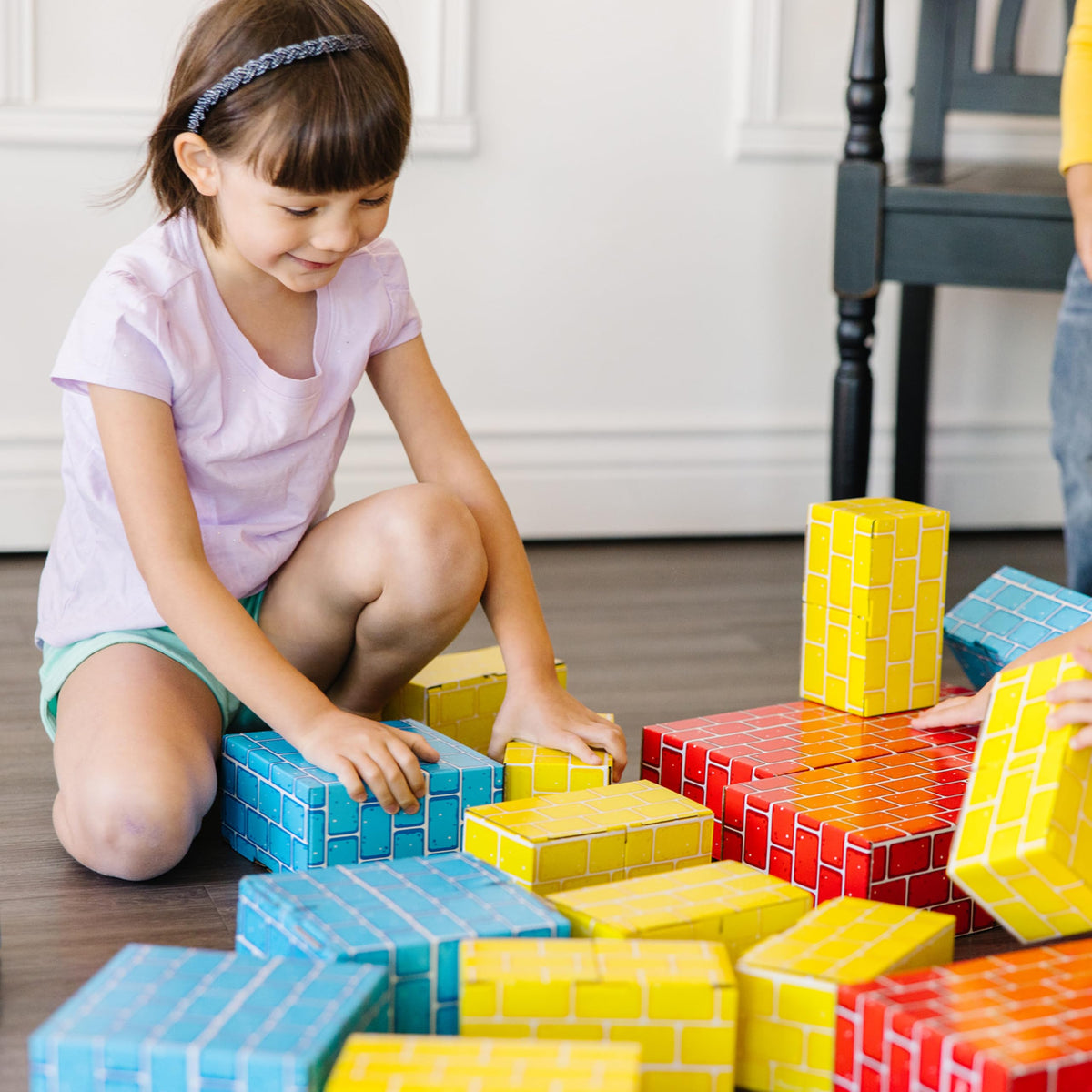 Lightweight design helps toddlers lift and stack Melissa & Doug blocks.