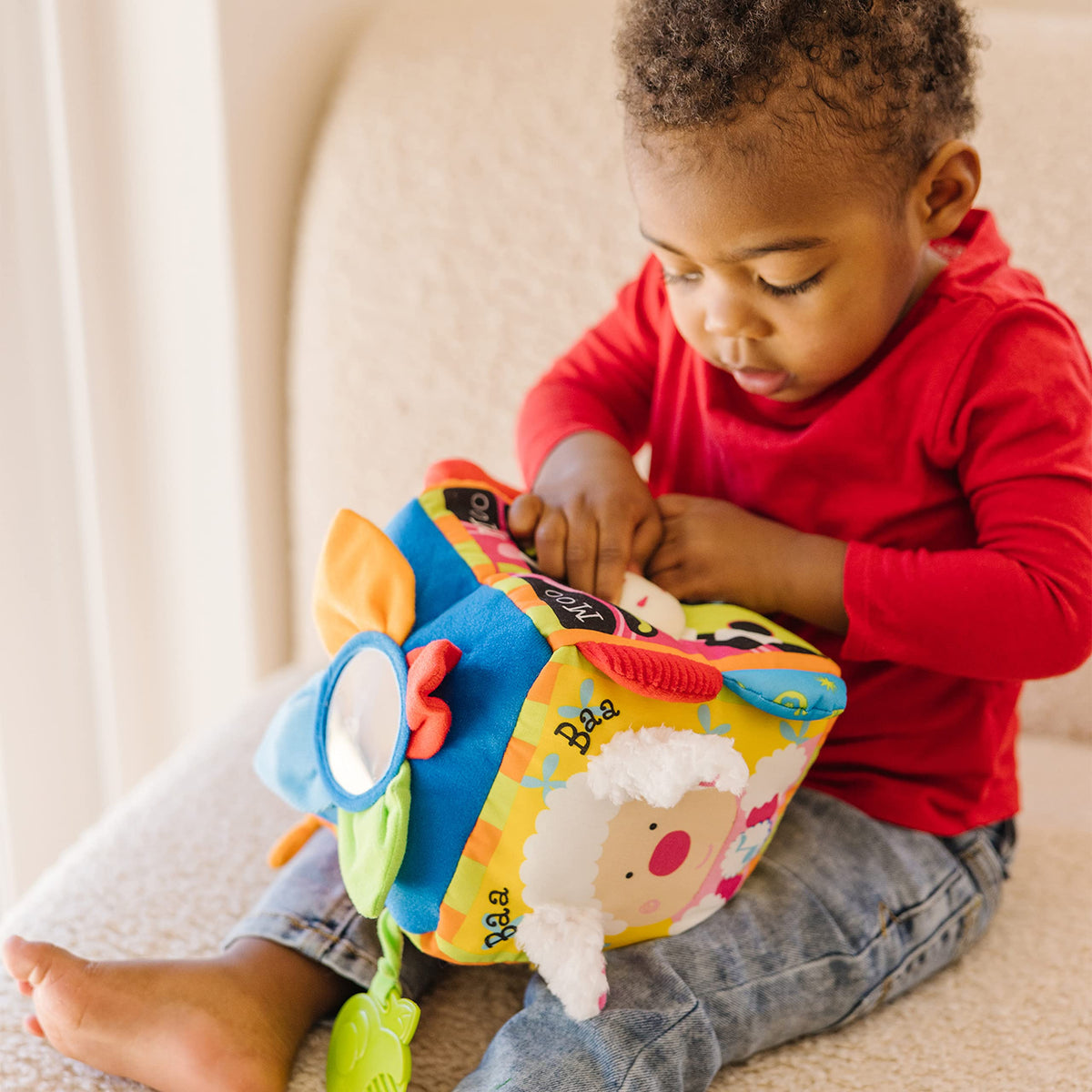 Melissa & Doug K's Kids Musical Farmyard Cube crinkly petals engage senses.