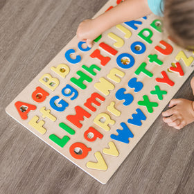Melissa and Doug kids playing with puzzle for ages four to seven
