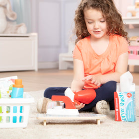 Melissa & Doug detergent bottle with removable cap for realistic filling and pouring.